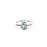 9ct White gold diamond and Oval Blue topaz ring